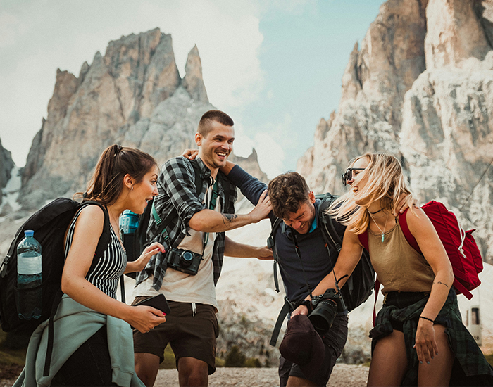 cultural-exchange Decorative image of students enjoy themselves, laughing together, and preparing to go hiking.